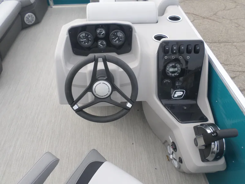 Slide: The Image of 2025 Princecraft Vectra 23 XT boat dashboard with steering wheel and control panel. - 5