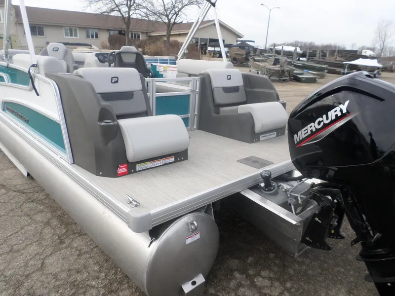 Slide: The Image of 2025 Princecraft Vectra 23 XT pontoon boat with Mercury outboard motor, docked outdoors. - 6