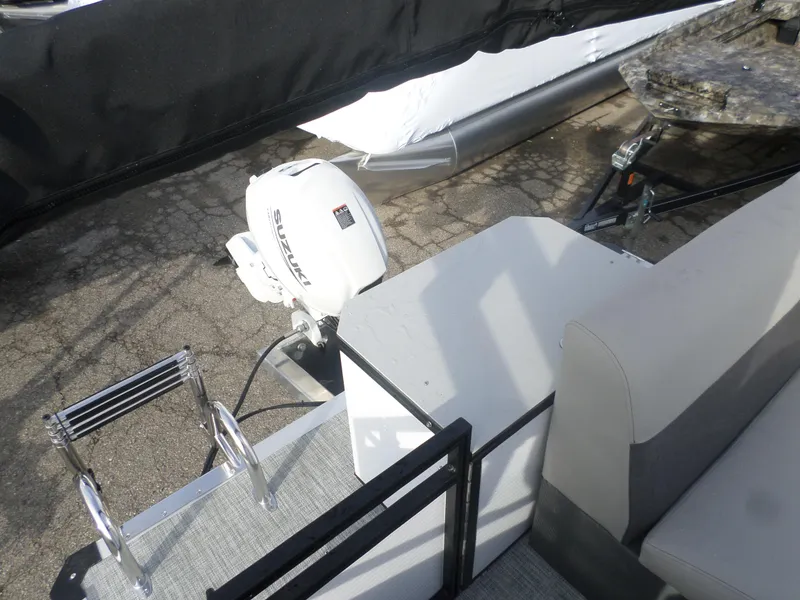 Slide: The Image of 2025 Angler Quest 816 Panfish Cruise boat with Suzuki outboard motor and boarding ladder. - 3