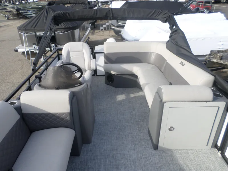 Slide: The Image of 2025 Angler Quest 816 Panfish Cruise interior with seating and steering console. - 5