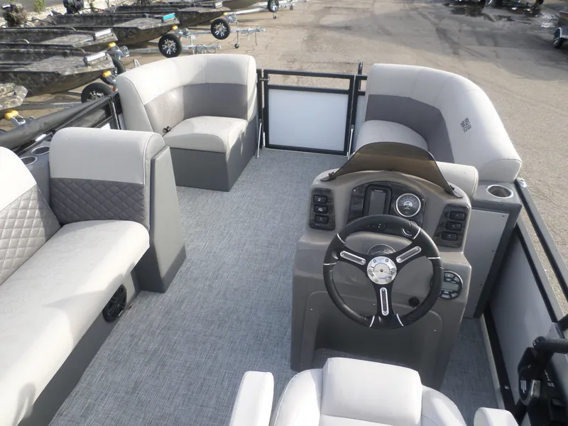 Slide: The Image of 2025 Angler Quest 816 Panfish Cruise boat interior with steering console and seating. - 6