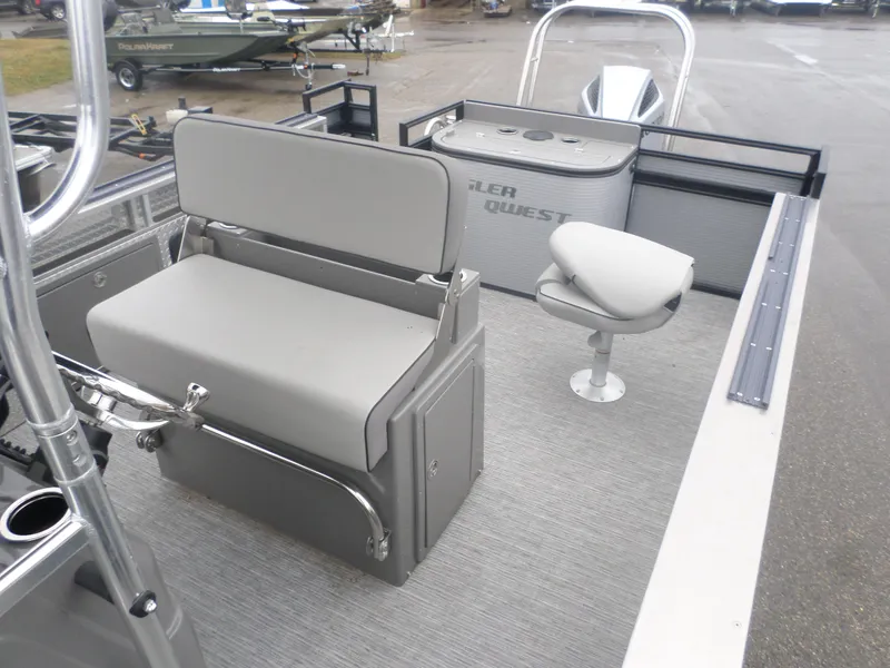 Slide: The Image of 2024 Angler Quest 8522/24 Pro Fish N Cruise boat interior with seating and fishing setup. - 3