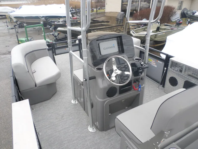 Slide: The Image of 2024 Angler Quest 8522/24 Pro Fish N Cruise boat interior with Garmin navigation system. - 4
