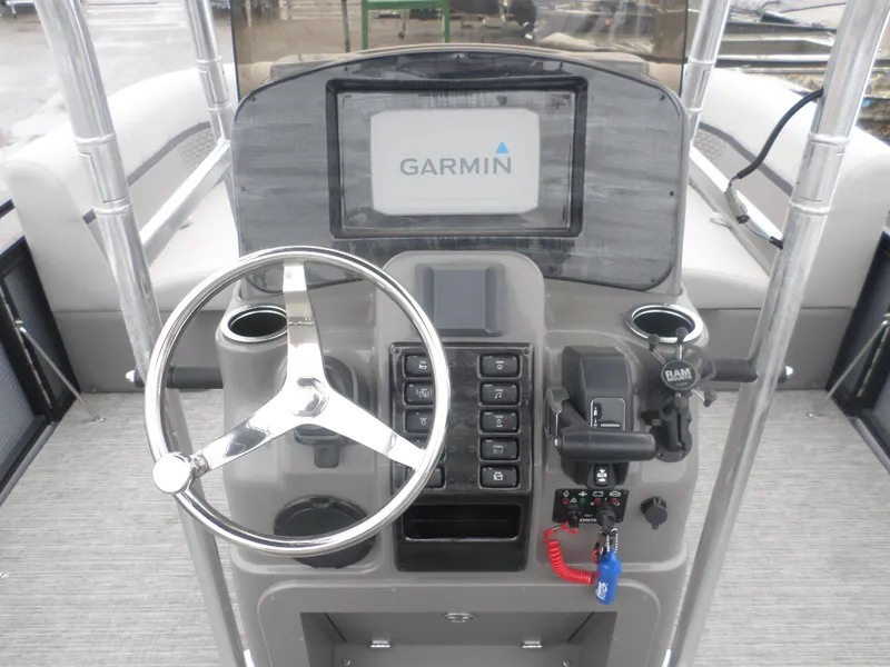 Slide: The Image of 2024 Angler Quest 8522/24 Pro Fish N Cruise dashboard with Garmin display and steering wheel. - 5