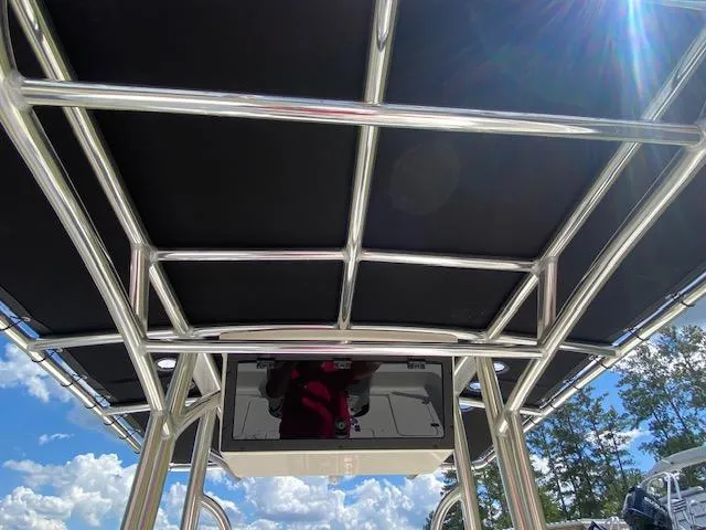 Slide: The Image of 2024 Bulls Bay 2200 boat canopy with stainless steel frame under sunny sky. - 12