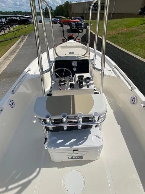 Slide: The Image of 2024 Bulls Bay 2200 boat interior with steering console and rod holders. - 4
