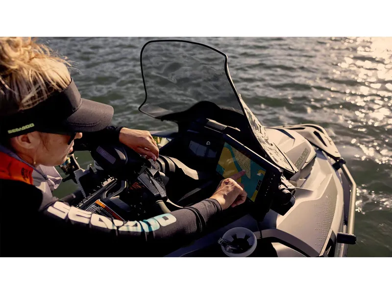 Slide: The Image of 2025 Sea-Doo FishPro Apex 300 with touchscreen navigation on water. - 8