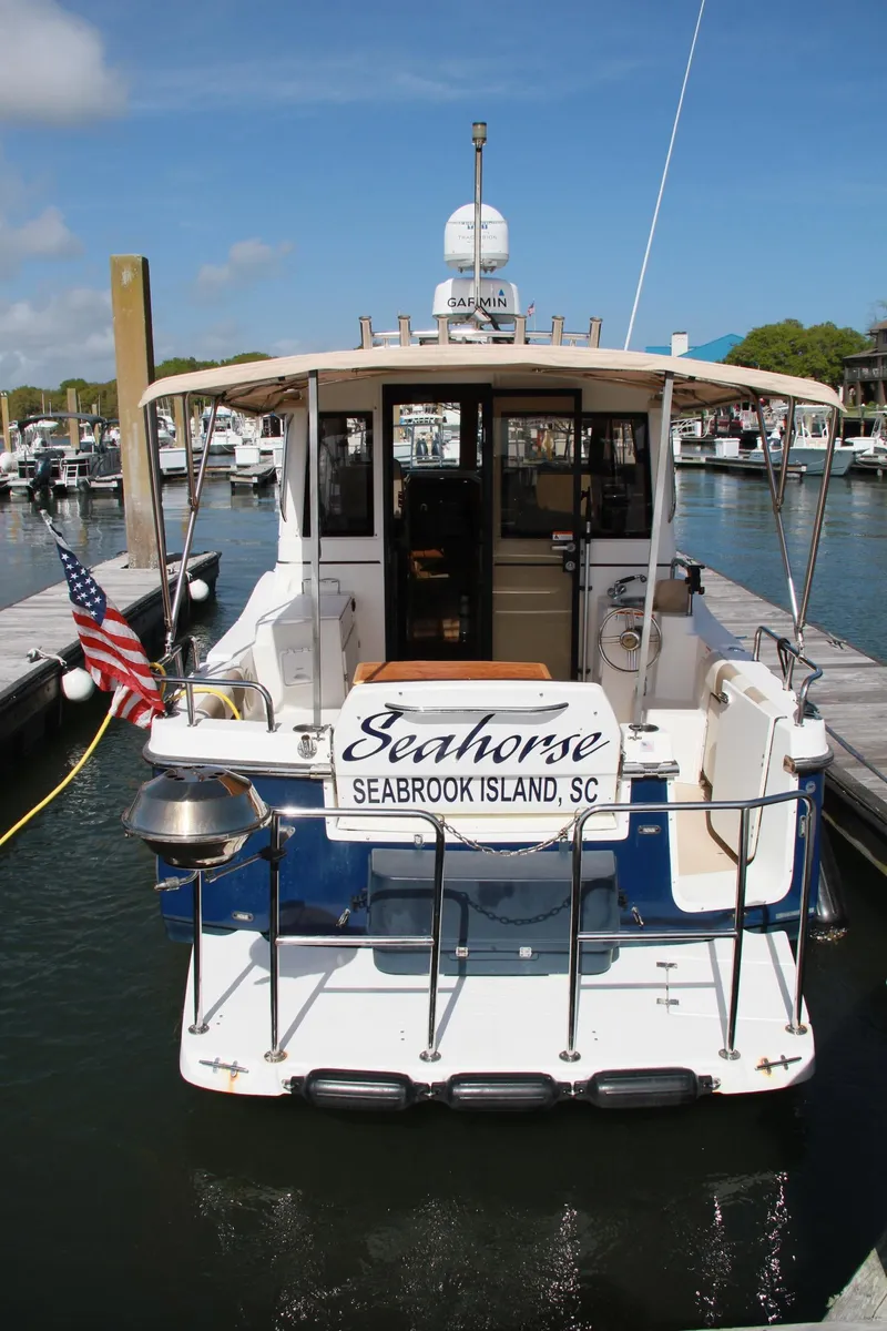 Slide: The Image of 2016 Cutwater 28 LE boat docked at marina, displaying "Seahorse" from Seabrook Island, SC. - 11