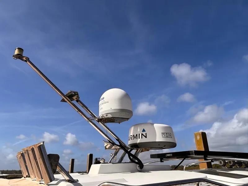 Slide: The Image of Cutwater 28 LE 2016 boat with Garmin radar equipment against a clear blue sky. - 12