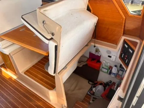 Slide: The Image of 2016 Cutwater 28 LE interior with wooden flooring and storage compartments. - 26