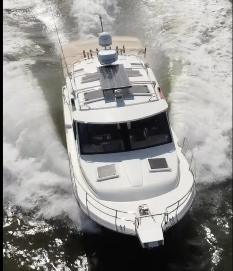 Slide: The Image of 2016 Cutwater 28 LE cruising on water, aerial view. - 4