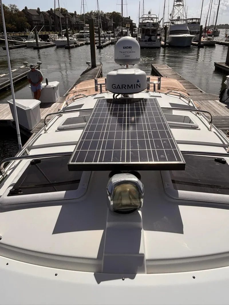 Slide: The Image of 2016 Cutwater 28 LE boat with solar panel and Garmin equipment at marina. - 9