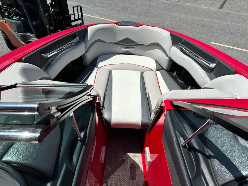 Slide: The Image of 2015 Supra SG400-550 boat interior with red and gray seating. - 10