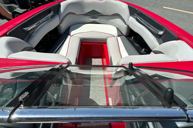 Slide: The Image of 2015 Supra SG400-550 boat interior with red and gray seating, viewed from the windshield. - 20