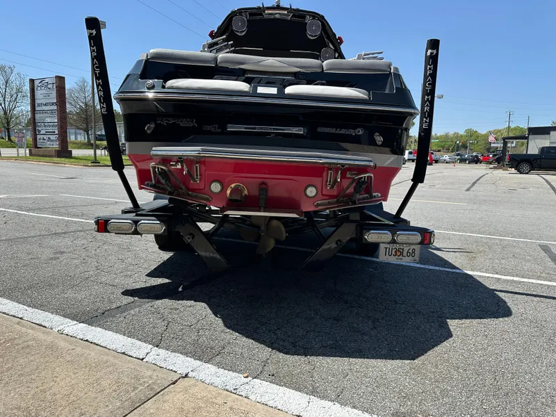 Slide: The Image of Rear view of a 2015 Supra SG400-550 boat parked in a lot. - 3
