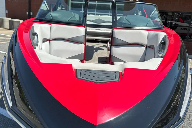 Slide: The Image of 2015 Supra SG400-550 boat with red and black exterior, white interior seating. - 7