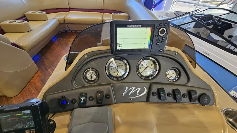 Slide: The Image of Control panel of 2017 Manitou 25 Aurora LE boat with gauges and navigation system. - 21