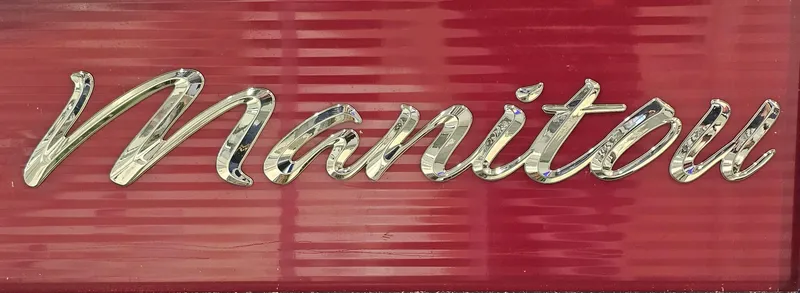 Slide: The Image of "Manitou" logo on red background, 2017 Manitou 25 Aurora LE model. - 37