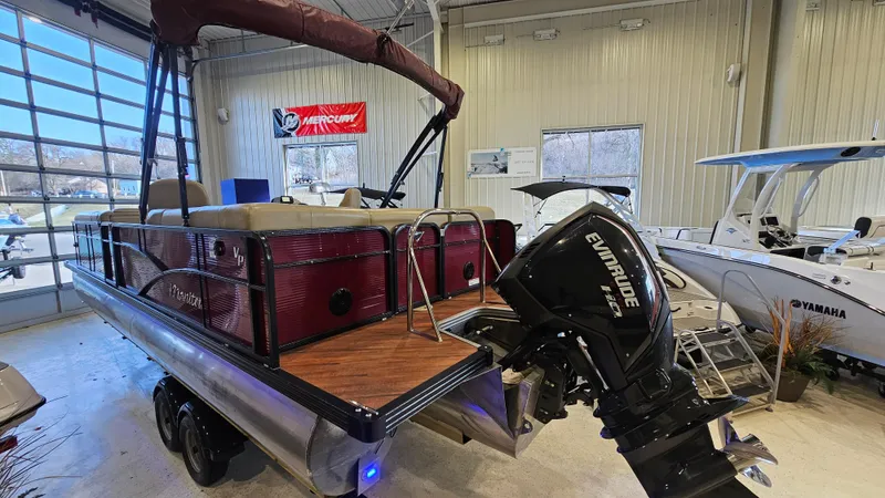 Slide: The Image of 2017 Manitou 25 Aurora LE pontoon boat with Evinrude motor in showroom. - 6