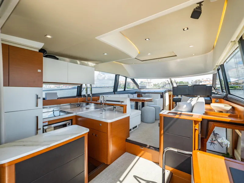 Slide: The Image of Luxurious interior of a 2017 Prestige 500 yacht with modern kitchen and seating area. - 14