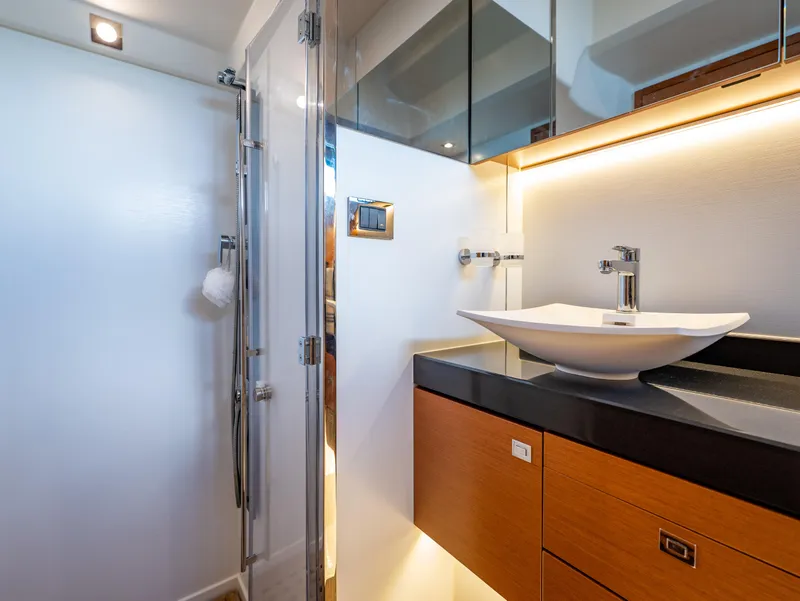 Slide: The Image of Luxurious bathroom in 2017 Prestige 500 yacht with modern sink and shower. - 17