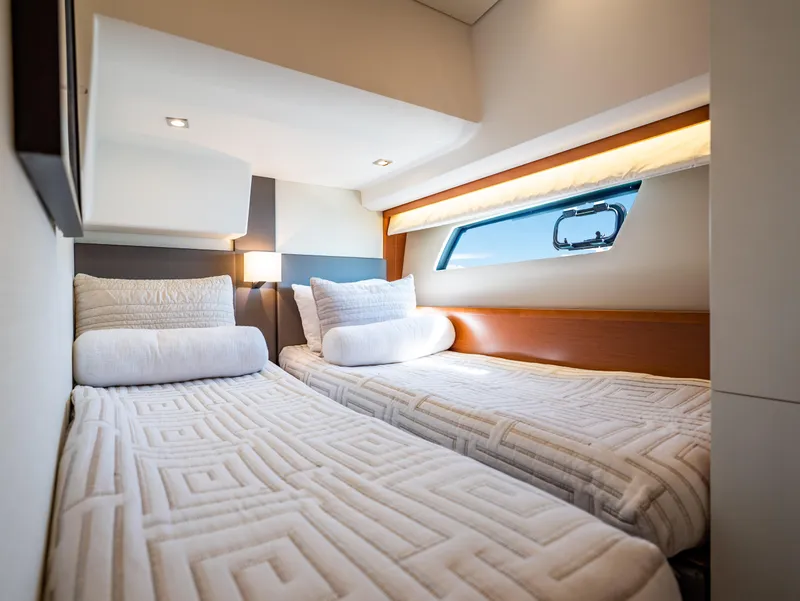 Slide: The Image of Luxurious twin cabin interior of 2017 Prestige 500 yacht with modern bedding and window view. - 25