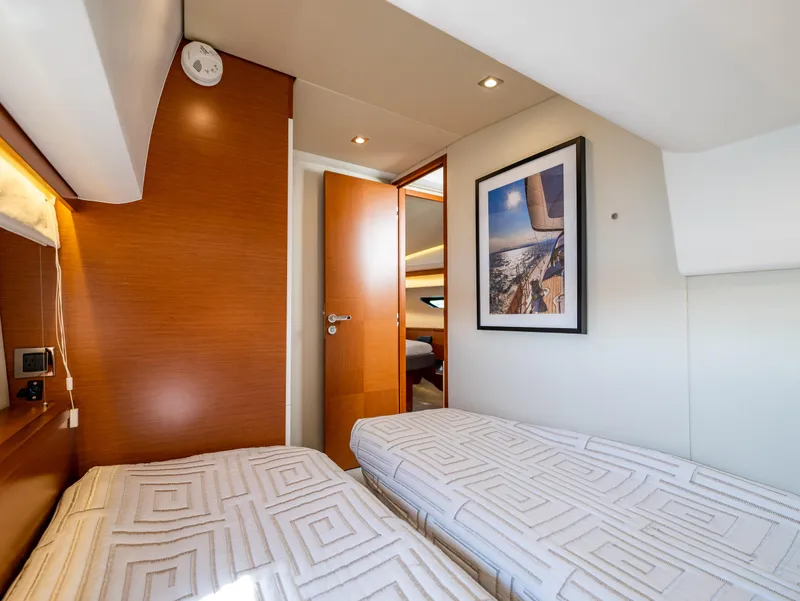 Slide: The Image of Luxurious cabin interior of 2017 Prestige 500 yacht with twin beds and modern decor. - 26