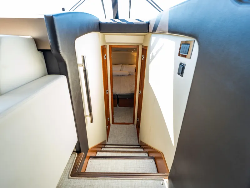 Slide: The Image of Stairway leading to cabin interior of 2017 Prestige 500 yacht. - 28