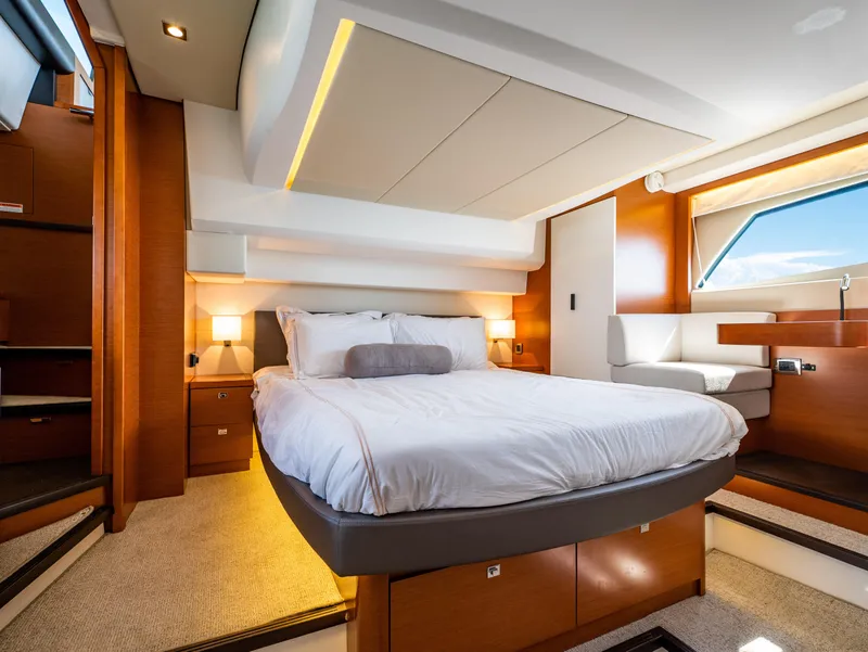 Slide: The Image of Luxurious bedroom interior of 2017 Prestige 500 yacht with modern design and cozy ambiance. - 30