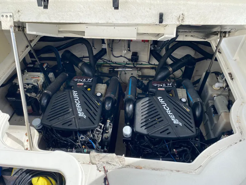 Slide: The Image of Engine compartment of a 2005 Sea Ray 340 Sundancer with twin Mercury engines. - 26