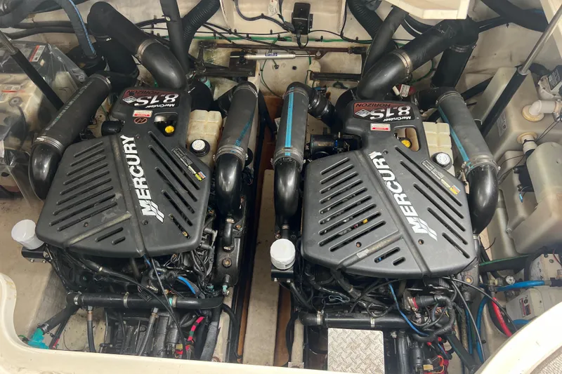 Slide: The Image of Twin Mercury engines in a 2005 Sea Ray 340 Sundancer boat. - 28