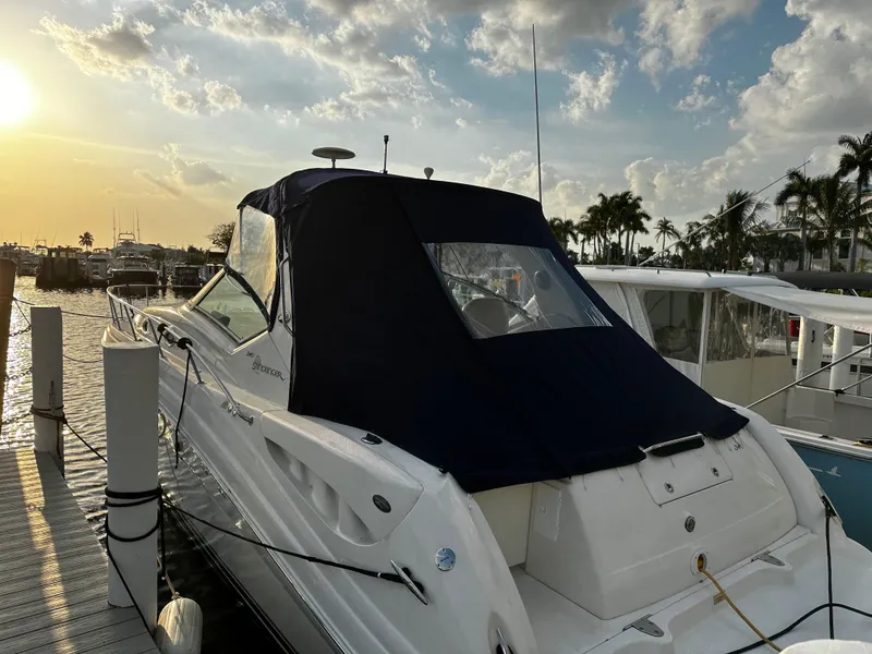 Slide: The Image of 2005 Sea Ray 340 Sundancer docked at sunset with covered cabin. - 3