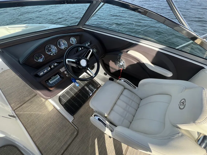 Slide: The Image of Interior of a 2015 Cobalt R3 boat with steering wheel and dashboard. - 19
