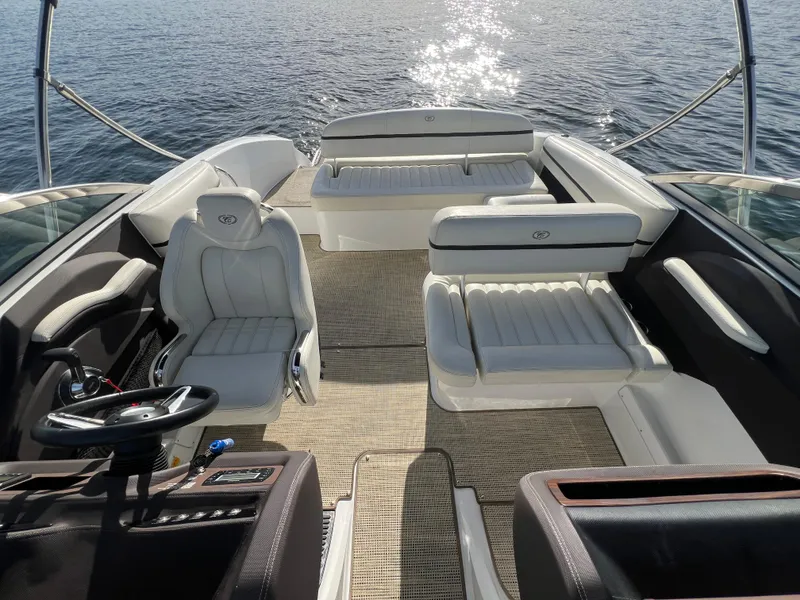Slide: The Image of 2015 Cobalt R3 boat interior with luxurious seating on calm water. - 21