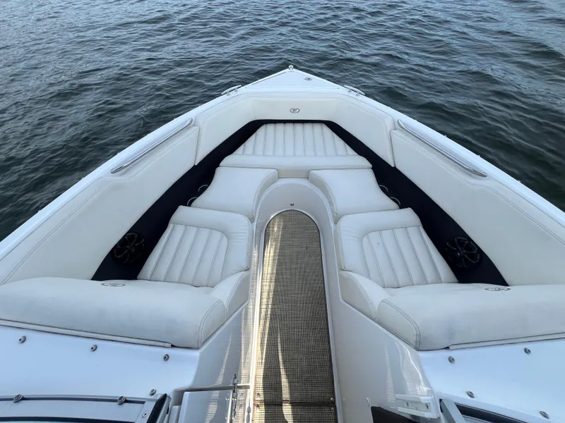 Slide: The Image of Bow seating area of a 2015 Cobalt R3 boat on water. - 22