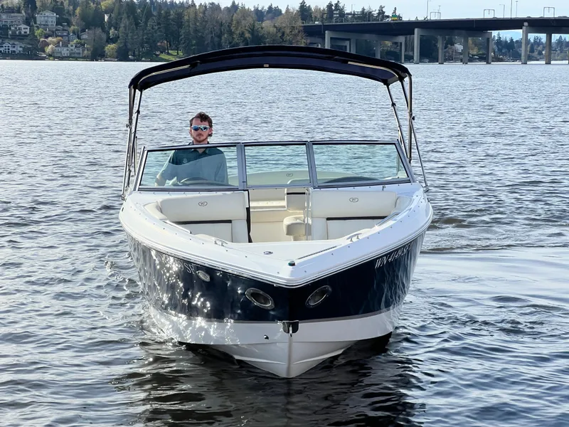 Slide: The Image of 2015 Cobalt R3 boat on a lake with a bridge and trees in the background. - 3