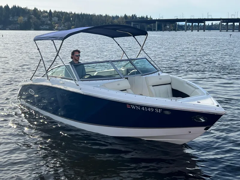 Slide: The Image of 2015 Cobalt R3 boat on a lake with a bridge in the background. - 4