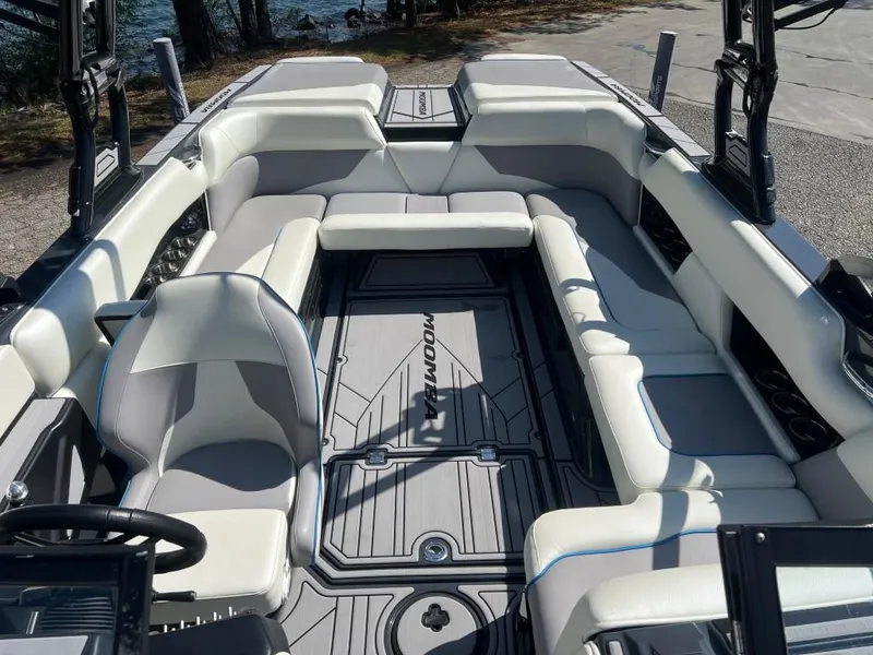 Slide: The Image of 2022 Moomba Mojo boat interior with spacious seating and modern design. - 14