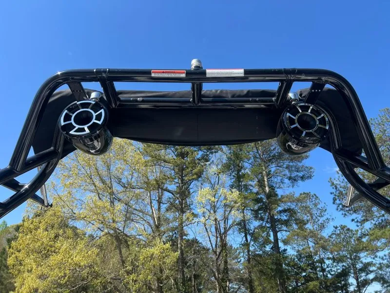 Slide: The Image of 2022 Moomba Mojo boat tower speakers against a clear blue sky and trees. - 17