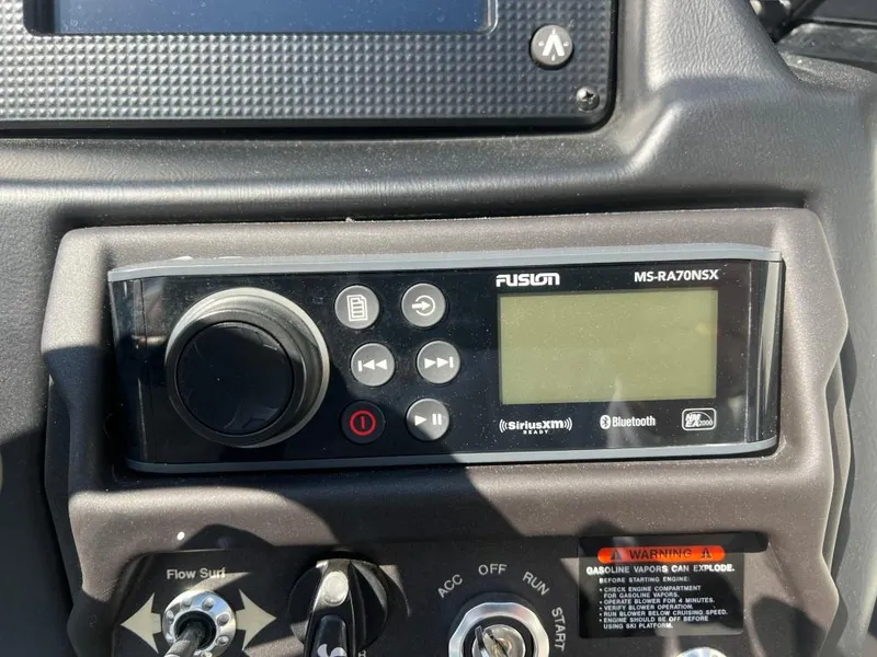 Slide: The Image of 2022 Moomba Mojo dashboard featuring Fusion MS-RA70NSX stereo system with Bluetooth connectivity. - 18