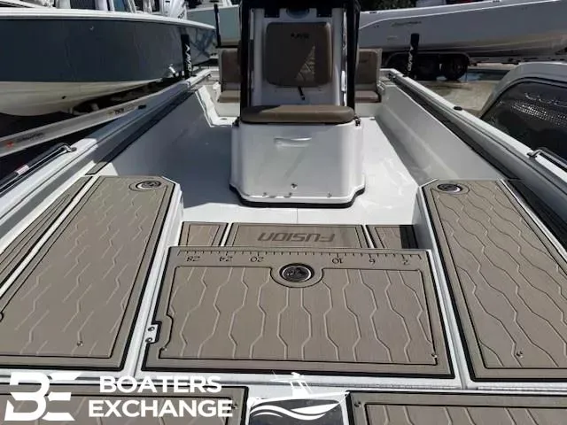 Slide: The Image of Avid 23 Fusion 2025 boat with spacious deck and seating area. - 10