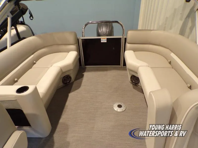 Slide: The Image of 2025 Godfrey EX2286SB pontoon boat interior with beige seating and carpeted floor. - 7
