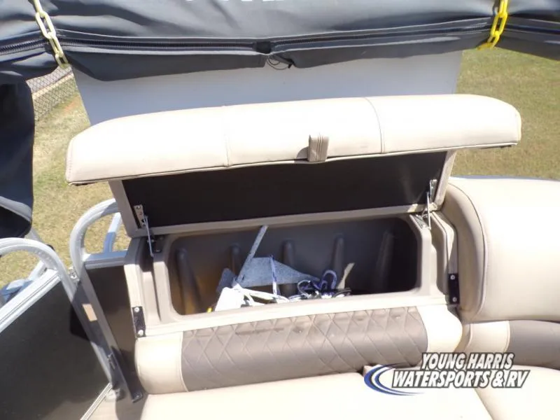 Slide: The Image of 2020 Sun Tracker Party Barge 20DLX storage compartment open, revealing interior space. - 14