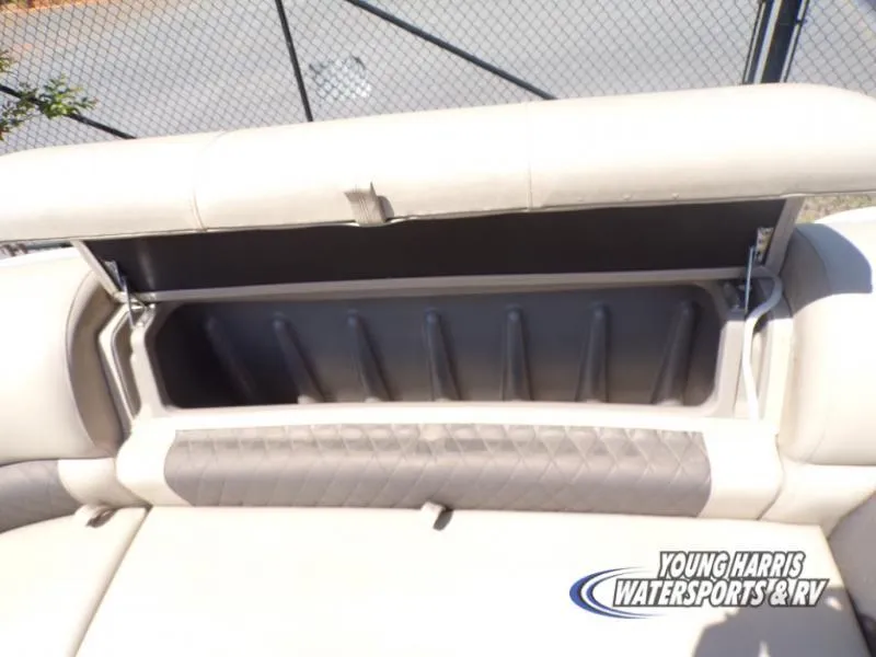 Slide: The Image of 2020 Sun Tracker Party Barge 20DLX storage compartment open, showcasing interior space. - 17