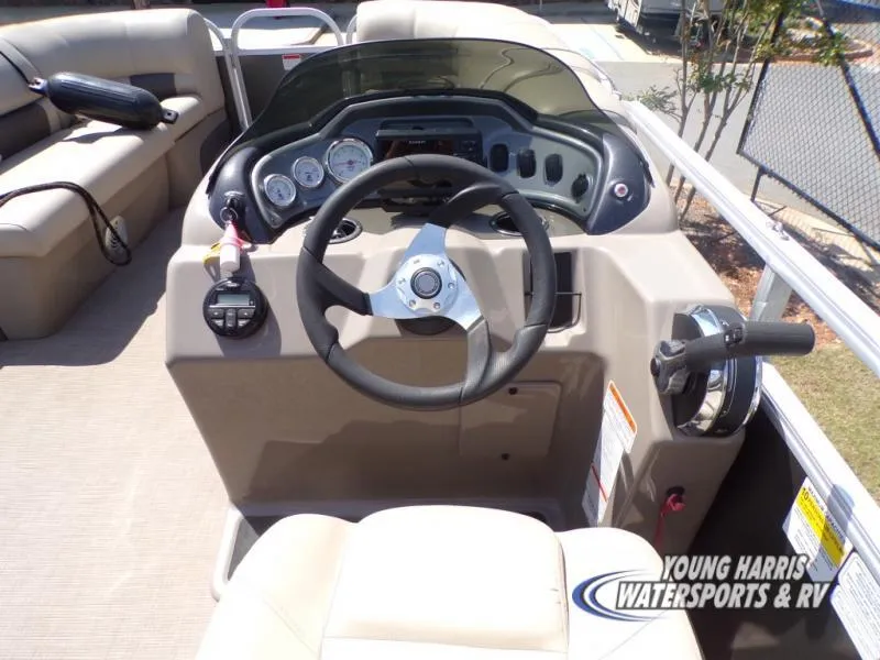 Slide: The Image of 2020 Sun Tracker Party Barge 20DLX helm with steering wheel and control panel. - 6