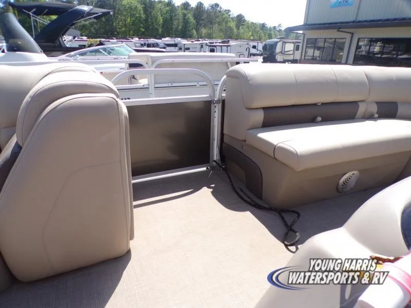 Slide: The Image of 2020 Sun Tracker Party Barge 20DLX interior with beige seating and open deck area. - 8
