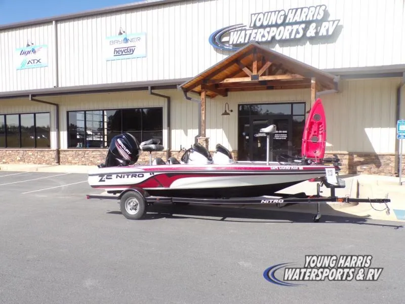 Slide: The Image of 2015 Tracker Nitro Z6 boat parked at Young Harris Watersports & RV dealership. - 3