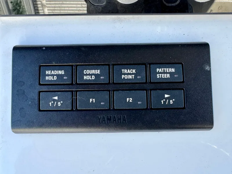 Slide: The Image of Control panel of a 2022 Sportsman 247OE boat with navigation buttons. - 16