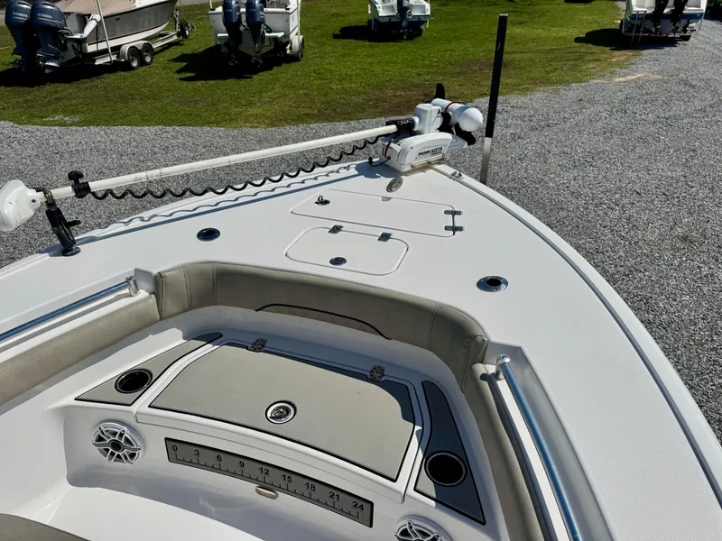 Slide: The Image of 2022 Sportsman 247OE boat deck with trolling motor and storage compartments. - 6