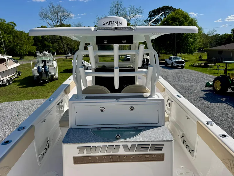 Slide: The Image of 2023 Twin Vee 280 GFX CC boat with Garmin equipment, parked outdoors. - 26